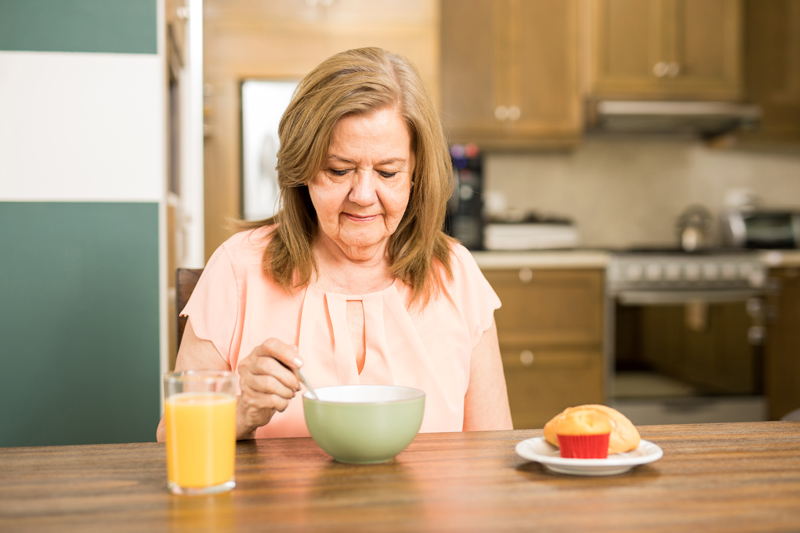 Senior Lady Drinking Soup at an Independent or Assisted Living Community in Victoria