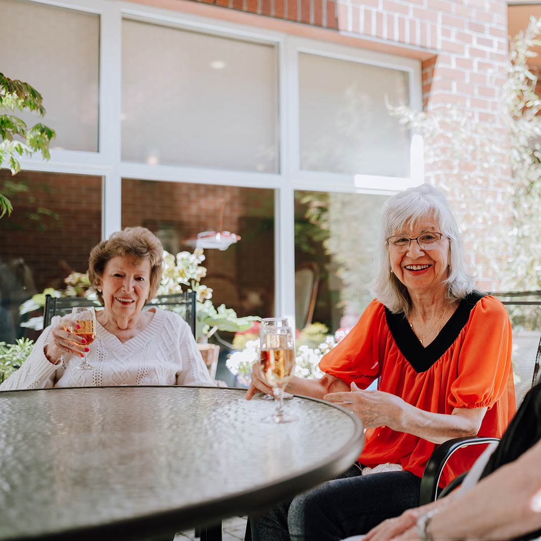 VRS Senior Home Ross Place Retirement Communities our story about card 3 residents on rooftop deck