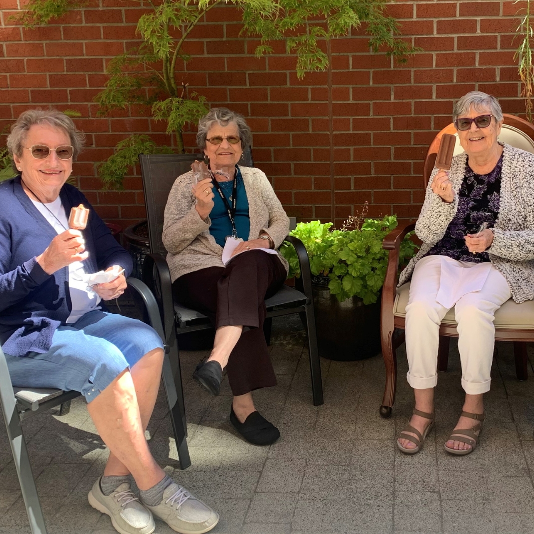 VRS Senior Home Ross Place Retirement Communities Our Story About Card 2 Residents enjoying a fudgsicle